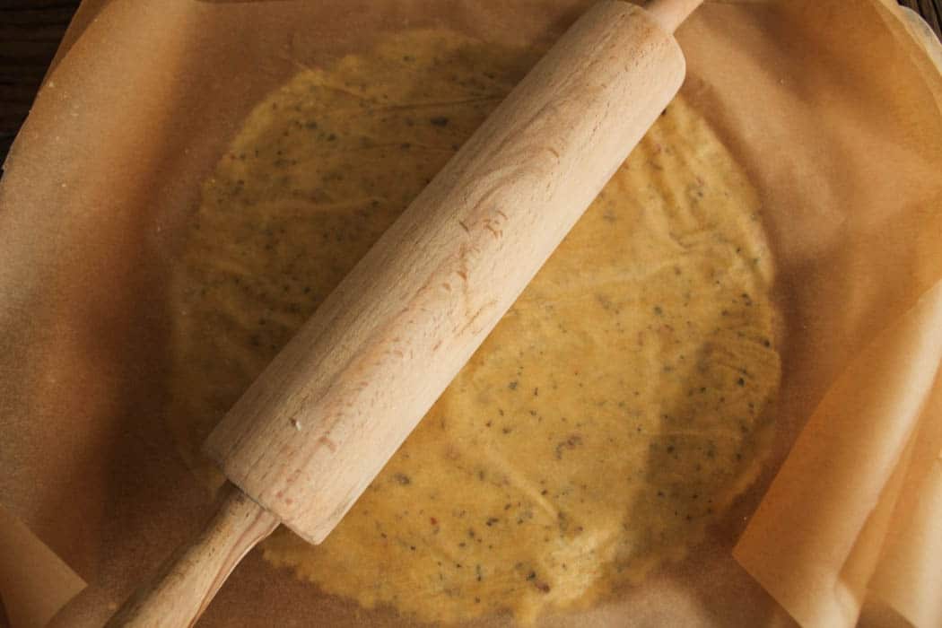 Cauliflower pizza dough being rolled out