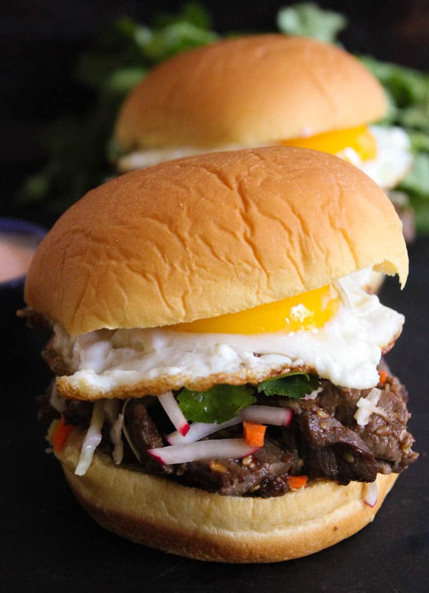 korean-steak-bulgogi-sandwiches-with-slaw-creamy-spicy-sauce-fried-eggs-10