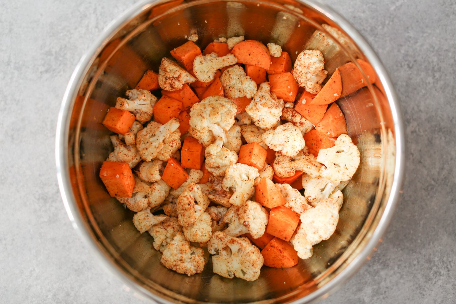 Sheet Pan Chicken Thighs with Cauliflower, Sweet Potatoes, and Pomegranate
